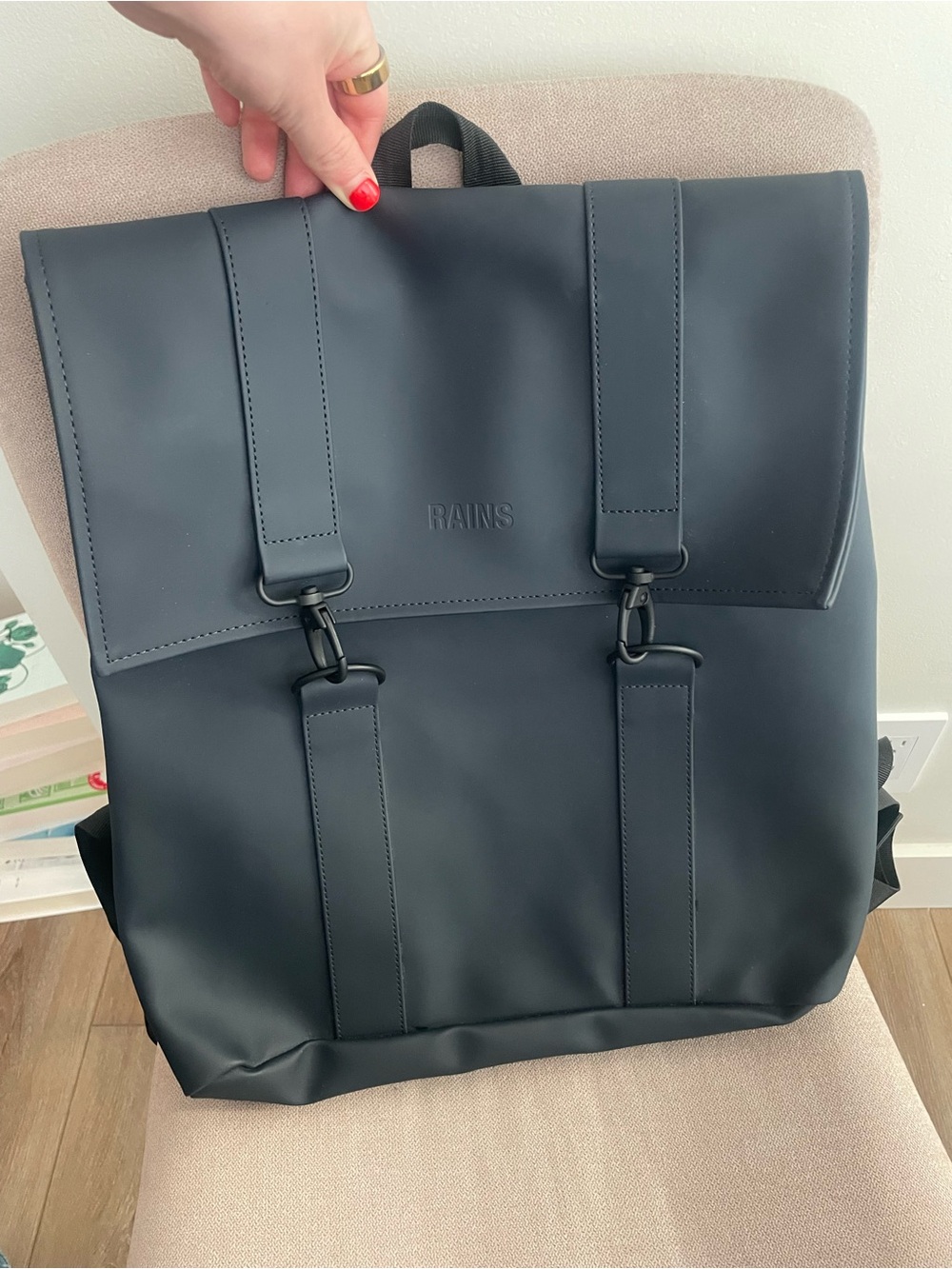 RAINS navy blue backpack